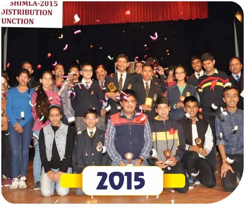 Brain of Himachal 2015 prize distribution function in Shimla: winners with trophies and guests on stage amid confetti (year label printed on the image)