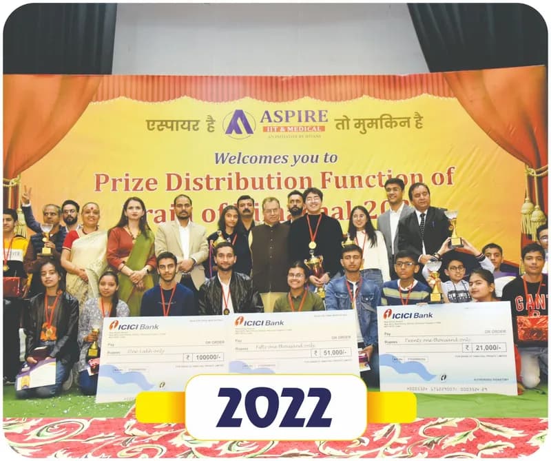 Brain of Himachal 2022 prize distribution: winners holding large scholarship cheques with guests on stage (year label printed on the image)
