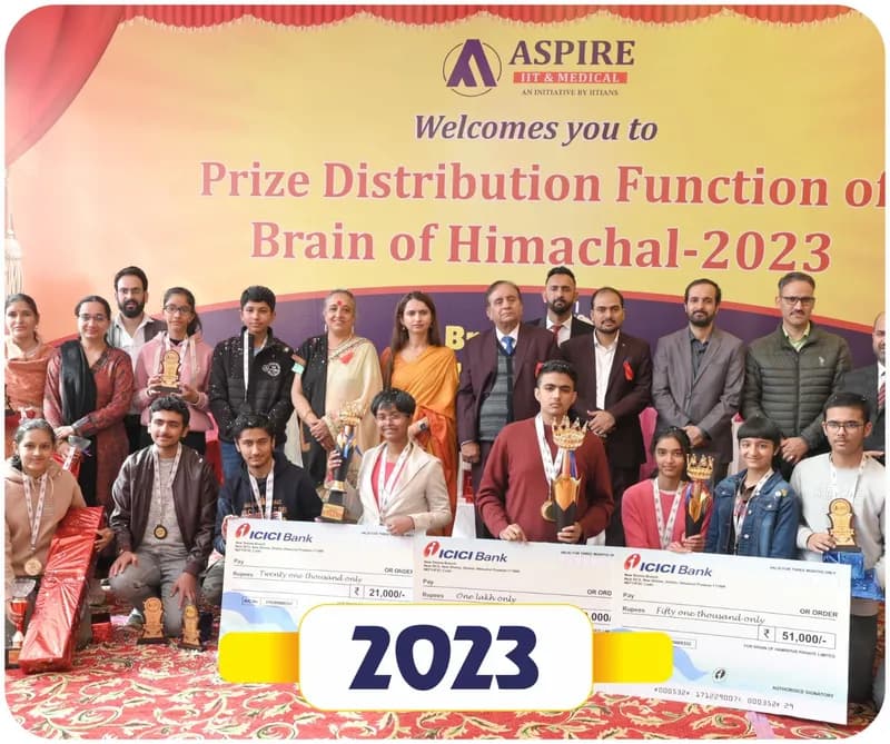 Brain of Himachal 2023 prize distribution: winners with trophies and scholarship cheques and guests on stage (year label printed on the image)