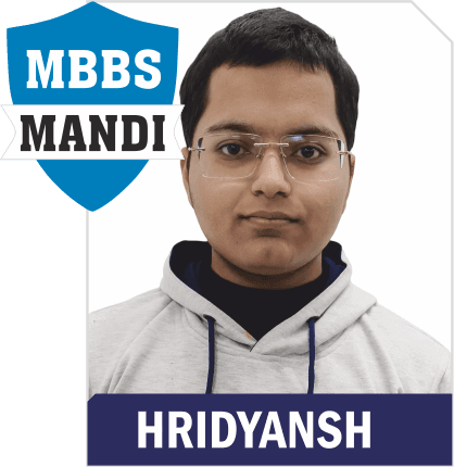 NEET 2025 result card from Aspire IIT & Medical: portrait of a selected student in an Aspire hoodie, with the student's name and allotted medical college printed on the card